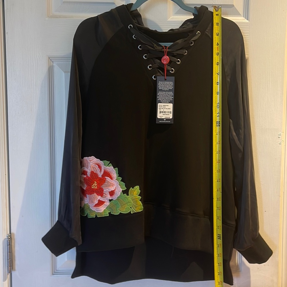 Black Hooded true religion jacket with big pink and red flower embroidery.